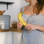 Healthy Lifestyle: Lady Enjoying a Nutrient-Packed Banana